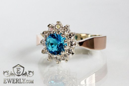Купить серебряное кольцо с золотом и голубым камнем для женщины