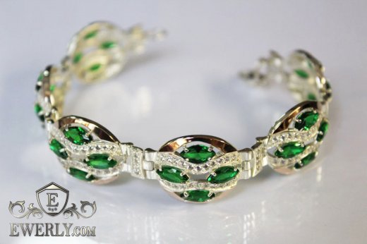 Купить женский браслет из серебра с зелёными фианитами и вставками золота