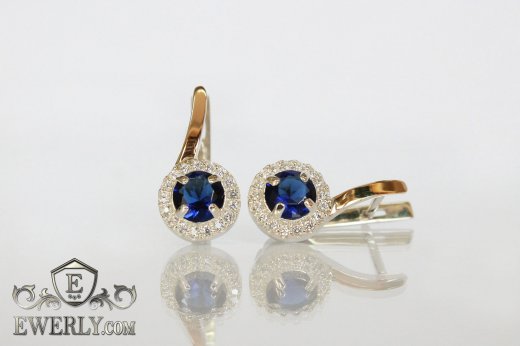 Купити жіночі срібні сережки з синіми каменями і золотими вставками