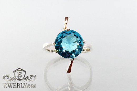 Купить женское кольцо из серебра с голубым камнем