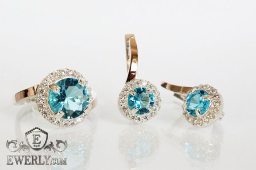 Жіночі кільце і сережки з золотом зі срібла, купити зі світло-блакитним камінням
