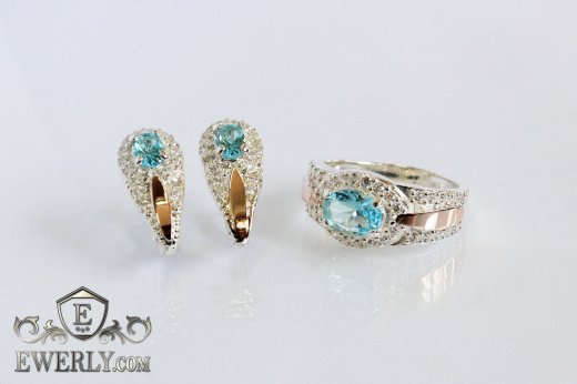 Купит женские серебряные серёжки и кольцо со светло-голубыми камнями